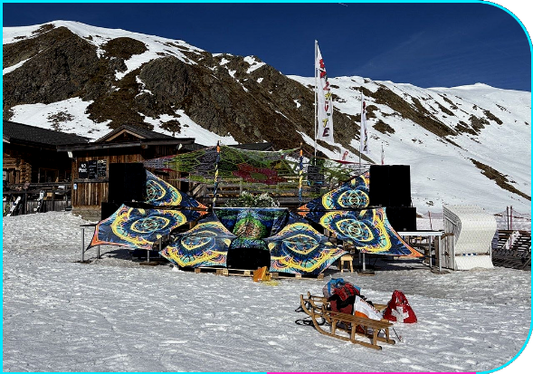 Outdoor UV stage decoration by Blacklight Illuminatis at SNEW Festival, Jatzhütte Davos, Switzerland